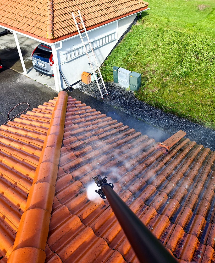 a person cleaning a roof