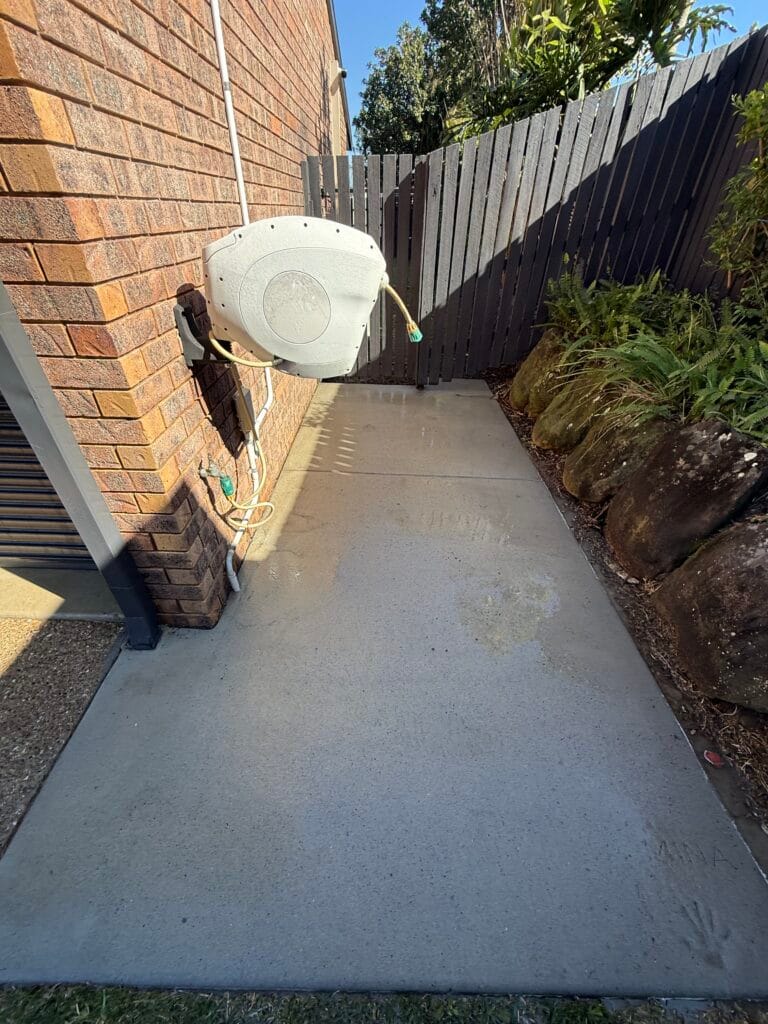A house wash in Wishart with concrete paths and driveways included. (after)